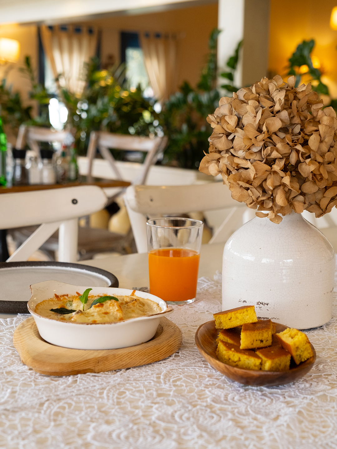 Restaurant table with a vase and plated food